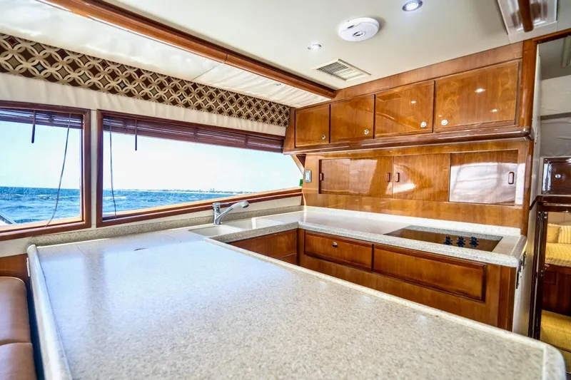 Slide: The Image of Luxurious kitchen interior of 2001 Bertram 510 Convertible yacht with ocean view. - 13