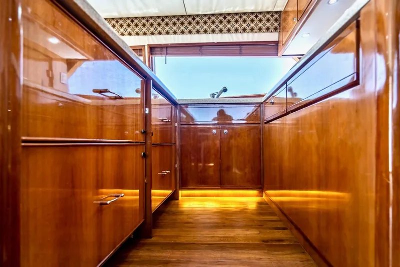 Slide: The Image of Luxurious wooden interior of 2001 Bertram 510 Convertible yacht kitchen. - 14