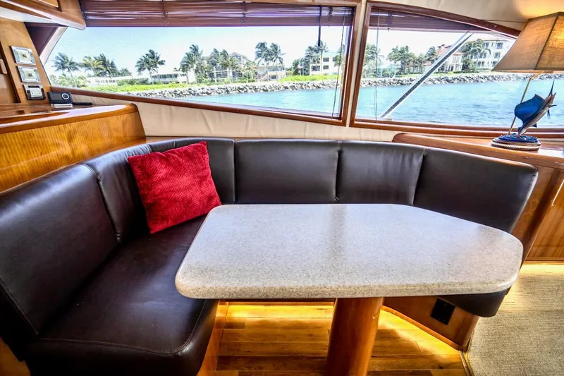 Slide: The Image of Luxurious interior of 2001 Bertram 510 Convertible yacht with leather seating and ocean view. - 15