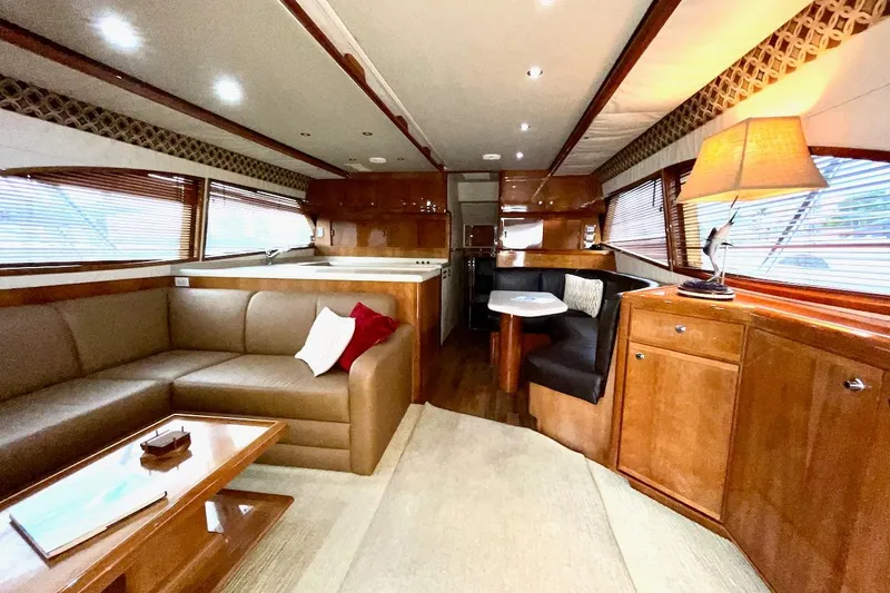 Slide: The Image of Luxurious interior of a 2001 Bertram 510 Convertible yacht with elegant wood finishes. - 2