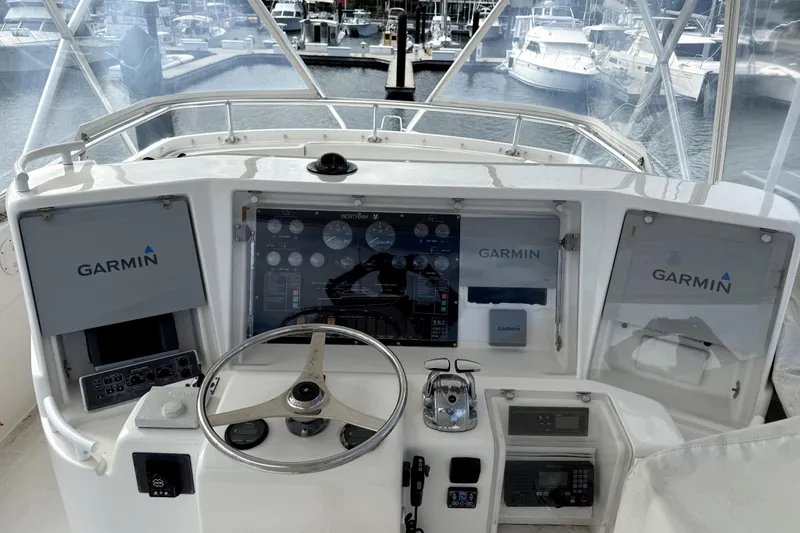 Slide: The Image of Cockpit of 2001 Bertram 510 Convertible with Garmin navigation system at marina. - 29