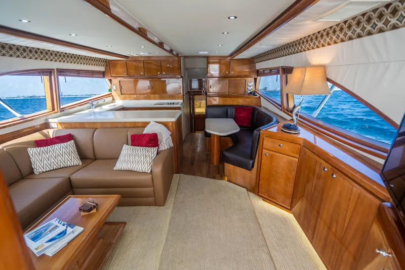 Slide: The Image of Luxurious interior of 2001 Bertram 510 Convertible yacht with elegant wood finishes and ocean view. - 3