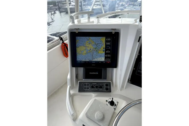 Slide: The Image of Bertram 510 Convertible 2001 boat dashboard with Garmin navigation system. - 33