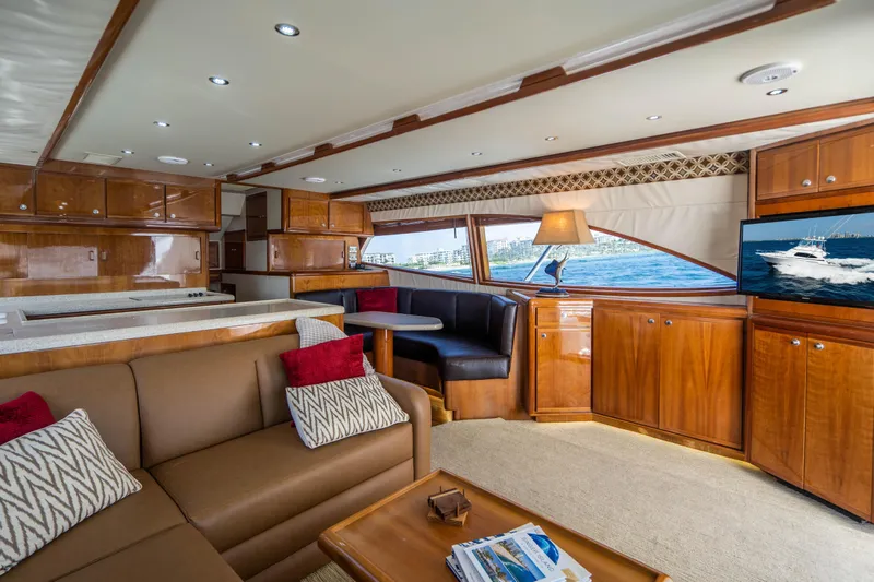 Slide: The Image of Luxurious interior of 2001 Bertram 510 Convertible yacht with elegant wood finishes and comfortable seating. - 4