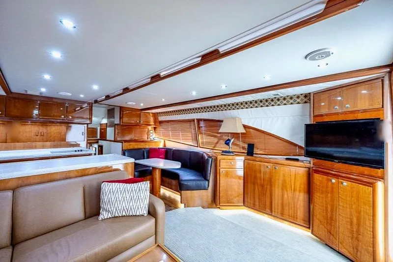 Slide: The Image of Luxurious interior of 2001 Bertram 510 Convertible yacht with elegant wood finishes and modern amenities. - 8