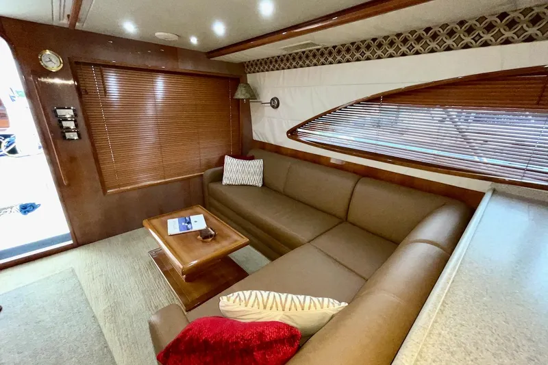 Slide: The Image of Luxurious interior of 2001 Bertram 510 Convertible yacht with leather seating and wooden accents. - 9