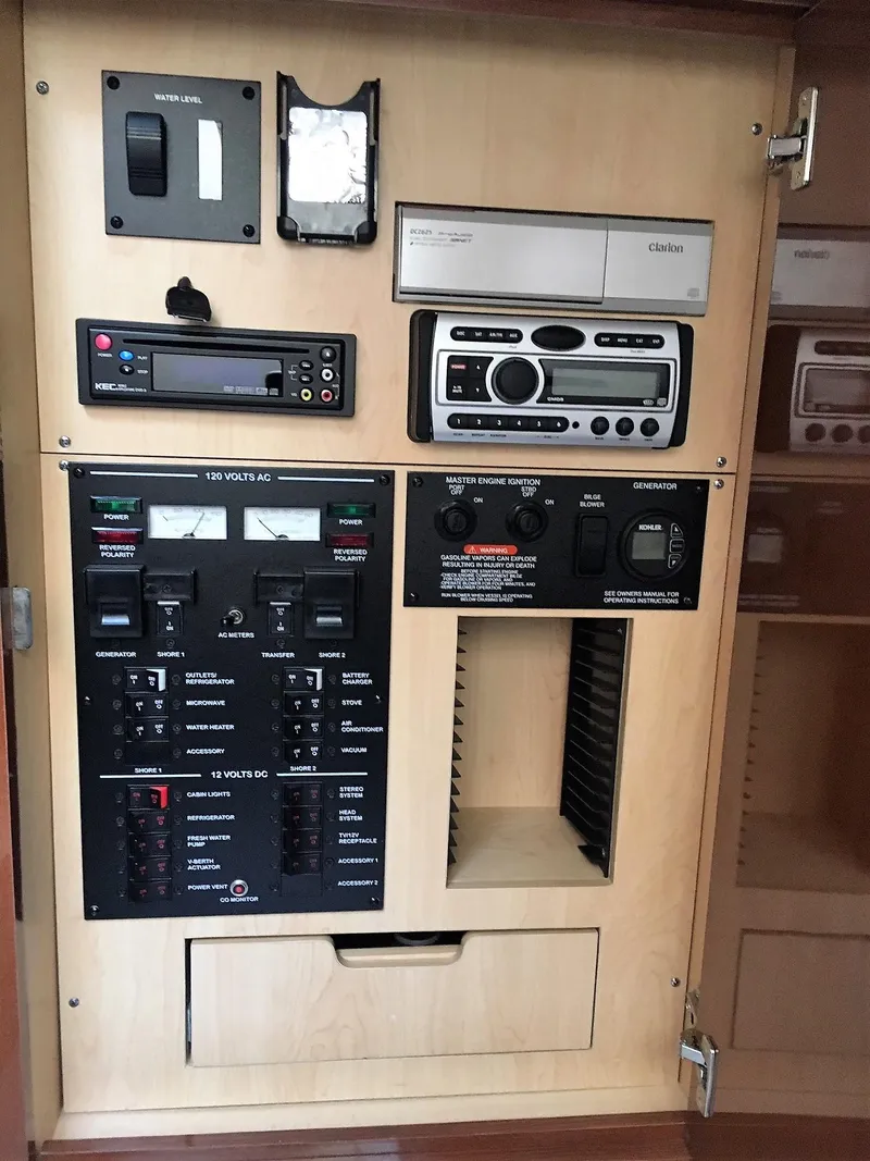 Slide: The Image of Control panel of a 2008 Sea Ray 330 Sundancer boat, featuring various electronic systems. - 27