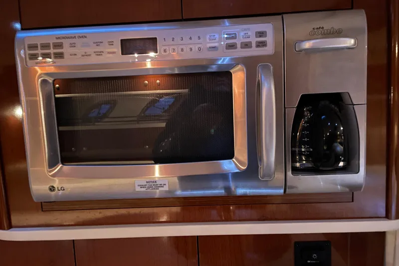 Slide: The Image of LG microwave and coffee maker combo in a 2008 Sea Ray 330 Sundancer yacht. - 36