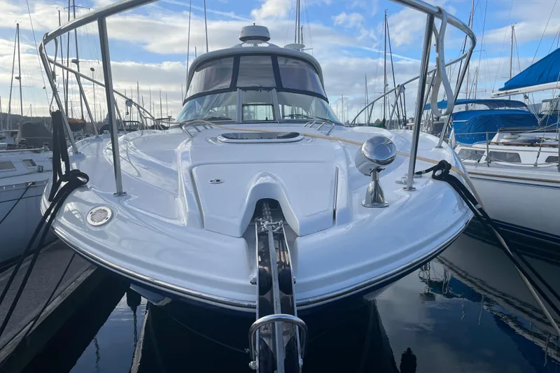 Slide: The Image of 2008 Sea Ray 330 Sundancer yacht docked at marina under blue sky. - 4