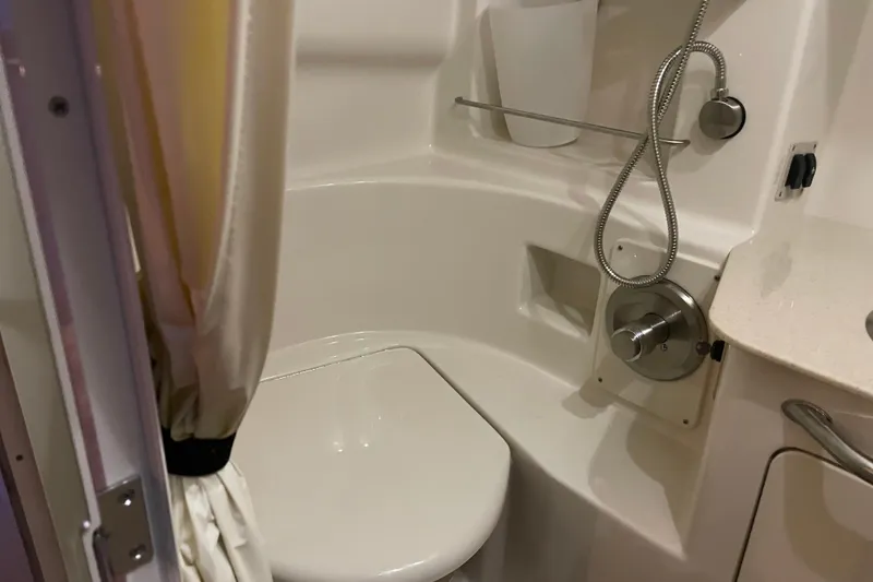 Slide: The Image of 2008 Sea Ray 330 Sundancer bathroom with shower and toilet. - 41