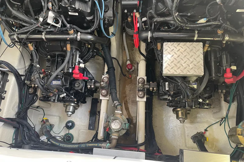 Slide: The Image of Engine compartment of a 2008 Sea Ray 330 Sundancer with visible mechanical components. - 46