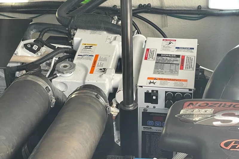 Slide: The Image of Engine compartment of a 2008 Sea Ray 330 Sundancer with Kohler generator. - 48