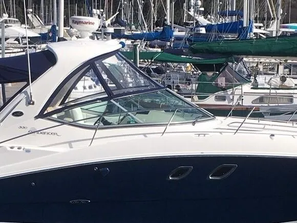 Slide: The Image of 2008 Sea Ray 330 Sundancer yacht docked in a marina with other boats. - 9