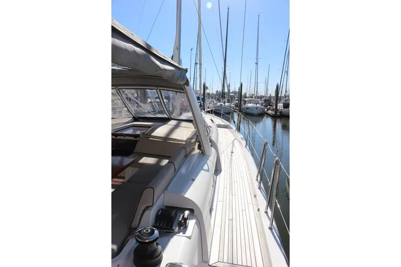 Slide: The Image of Luxurious bedroom interior of 2021 Beneteau Oceanis Yacht 54 with cozy bedding. - 18