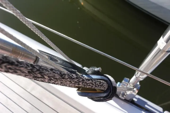 Slide: The Image of Bathroom interior of 2021 Beneteau Oceanis Yacht 54, featuring modern fixtures and wood cabinetry. - 22
