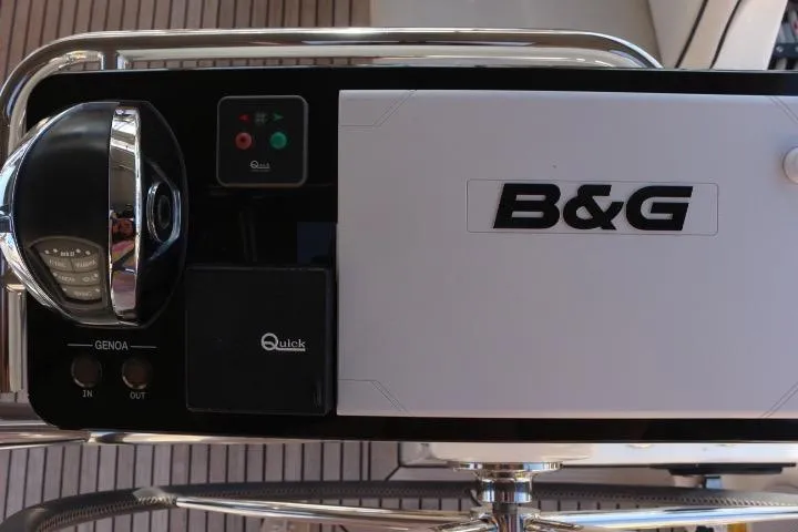 Slide: The Image of 2021 Beneteau Oceanis Yacht 54, docked with visible branding and mooring line. - 28