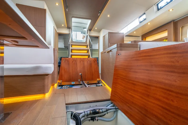 Slide: The Image of Interior of 2021 Beneteau Oceanis Yacht 54, showcasing modern design and wooden finishes. - 45