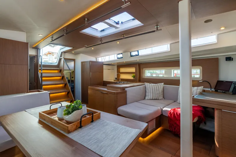 Slide: The Image of Luxurious interior of 2021 Beneteau Oceanis Yacht 54 with modern furnishings and natural light. - 49