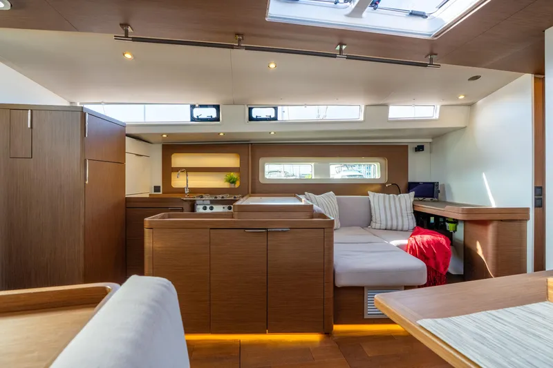 Slide: The Image of Luxurious interior of 2021 Beneteau Oceanis Yacht 54 with modern kitchen and cozy seating area. - 50