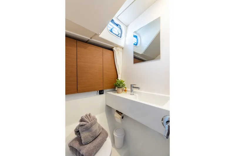 Slide: The Image of Modern bathroom interior of 2021 Beneteau Oceanis Yacht 54, featuring sleek design and natural light. - 57