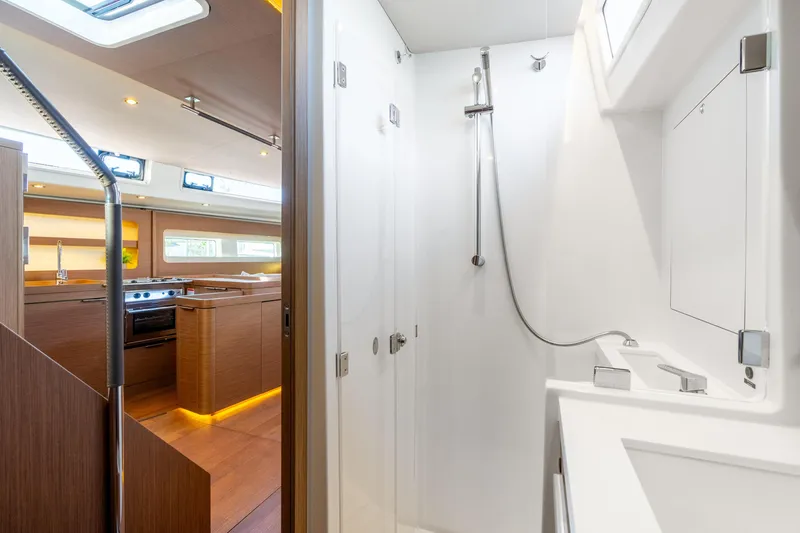Slide: The Image of Luxurious interior of 2021 Beneteau Oceanis Yacht 54, featuring modern kitchen and sleek bathroom. - 60
