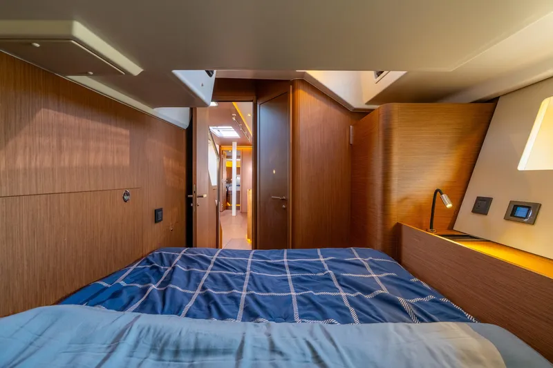 Slide: The Image of Luxurious cabin interior of 2021 Beneteau Oceanis Yacht 54 with modern wood finish. - 63