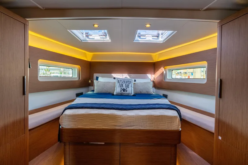 Slide: The Image of Luxurious cabin interior of 2021 Beneteau Oceanis Yacht 54 with cozy bedding and modern design. - 65
