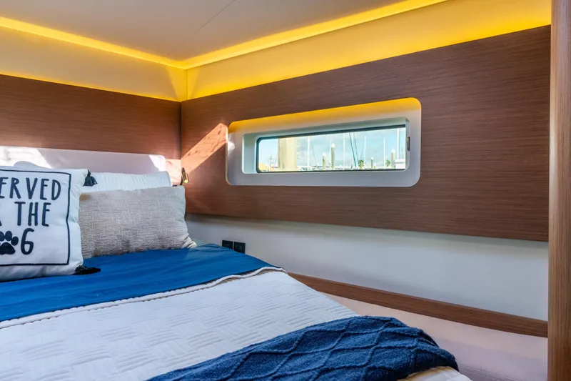 Slide: The Image of Luxurious cabin interior of 2021 Beneteau Oceanis Yacht 54 with modern design and cozy bedding. - 66