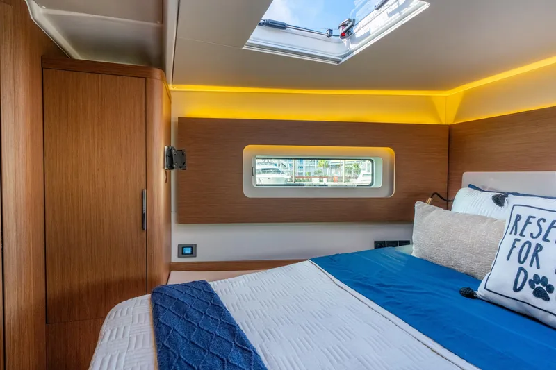 Slide: The Image of Luxurious cabin interior of 2021 Beneteau Oceanis Yacht 54 with modern design and skylight. - 67