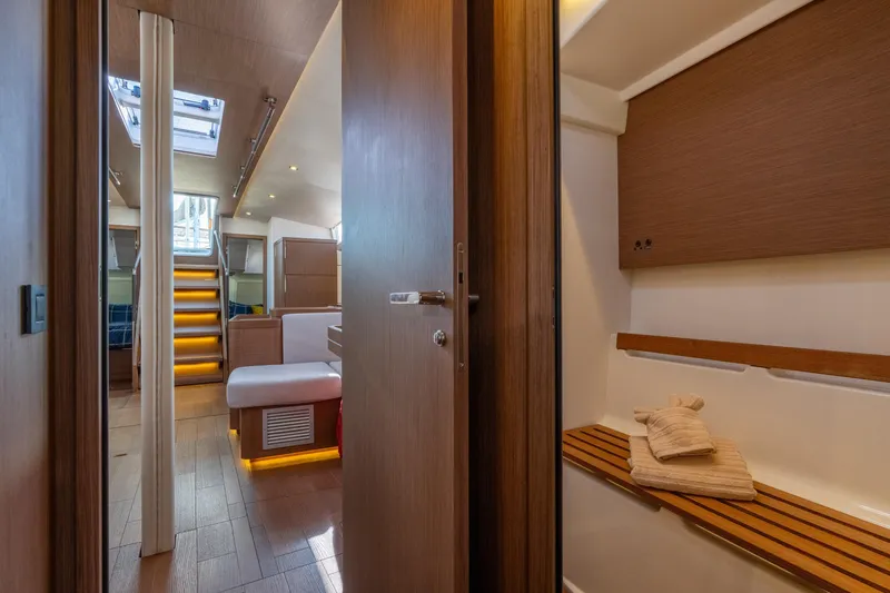 Slide: The Image of Interior of 2021 Beneteau Oceanis Yacht 54, featuring elegant wood finishes and modern design. - 68