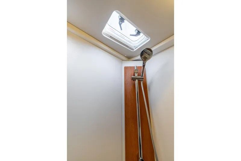 Slide: The Image of Shower area in 2021 Beneteau Oceanis Yacht 54 with skylight and modern fixtures. - 69
