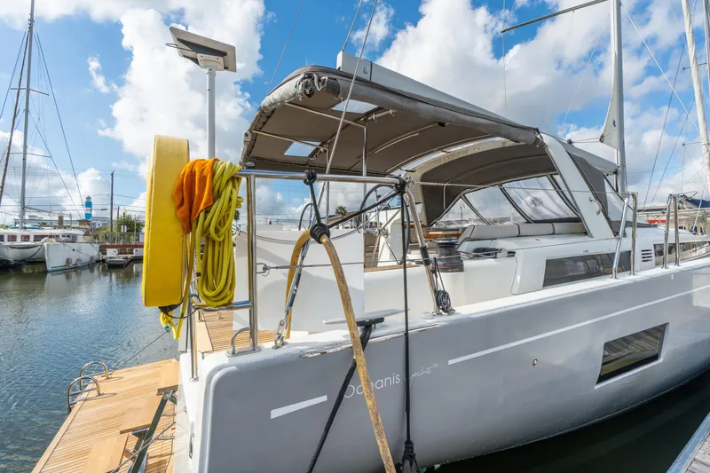 Slide: The Image of 2021 Beneteau Oceanis Yacht 54 docked, showcasing sleek design and spacious deck. - 79