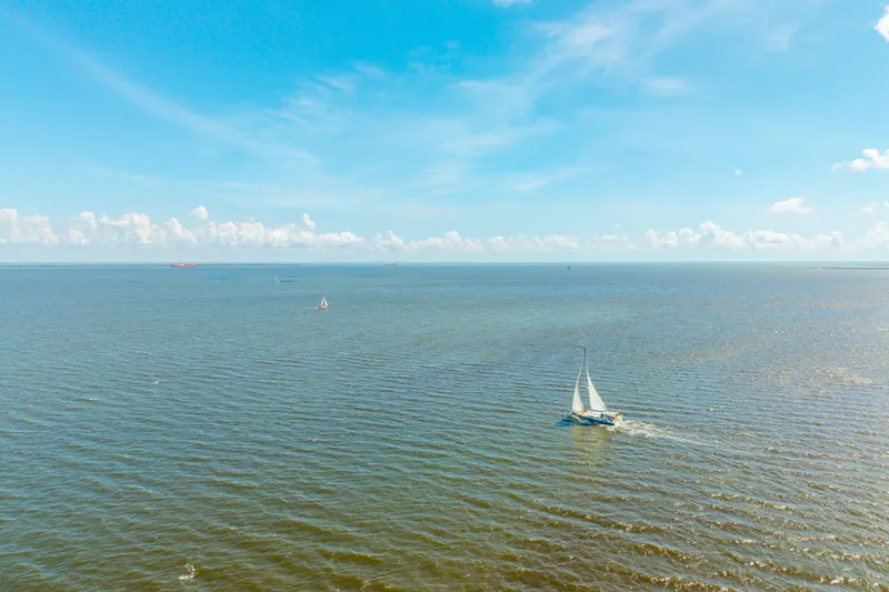 Slide: The Image of Sailboat cruising on open sea under clear blue sky, Beneteau Oceanis Yacht 54, 2021 model. - 90