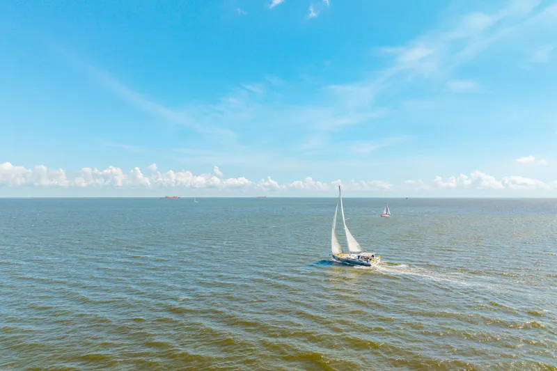 Slide: The Image of Sailing yacht Beneteau Oceanis Yacht 54, 2021, cruising on open sea under clear blue sky. - 92