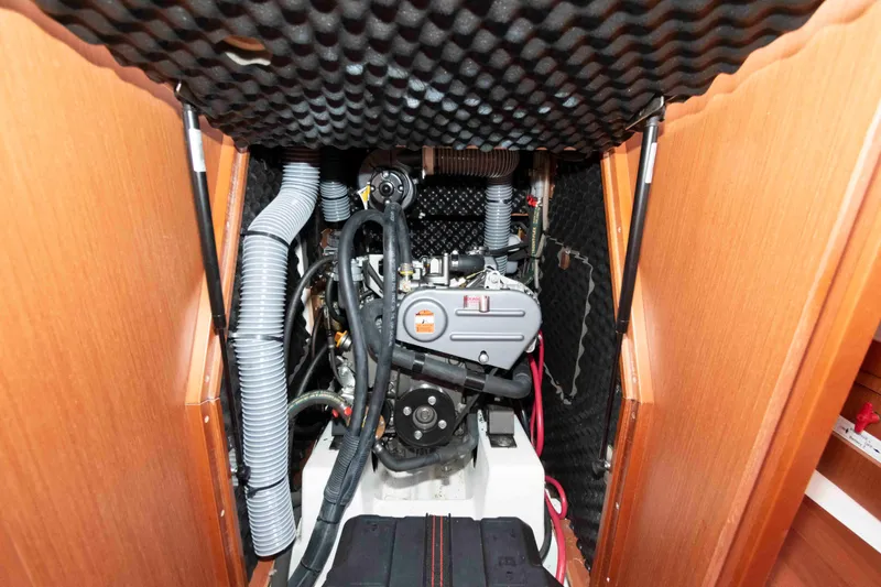 Slide: The Image of Engine compartment of a 2015 Beneteau Oceanis 37 sailboat, featuring detailed mechanical components. - 18