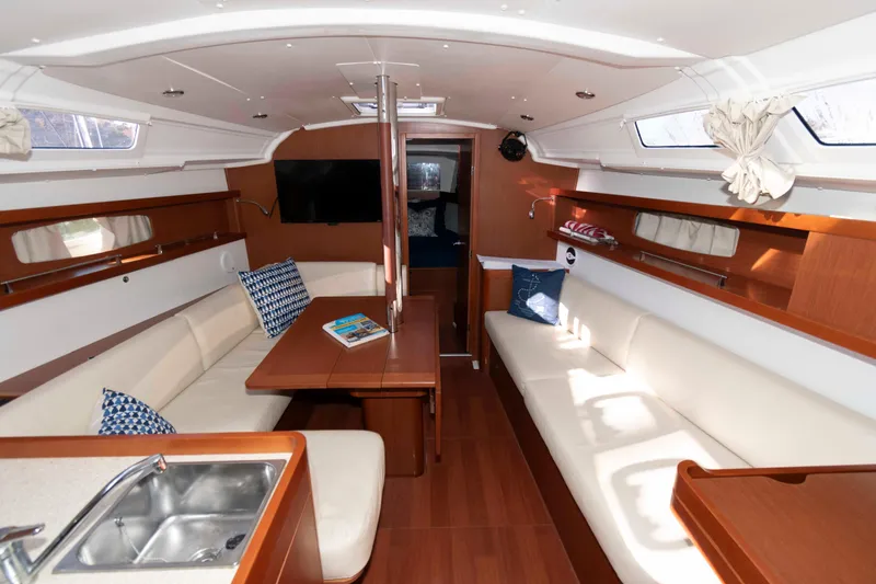 Slide: The Image of Interior of 2015 Beneteau Oceanis 37 yacht with elegant seating and modern amenities. - 9