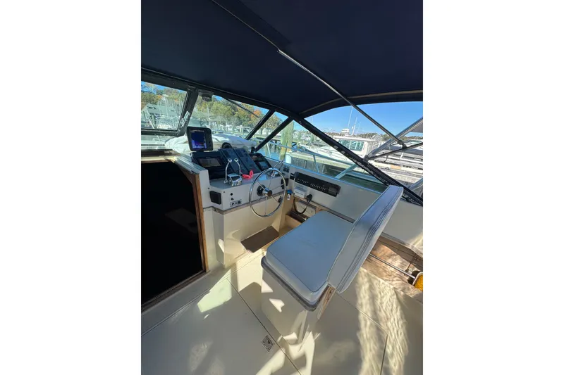 Slide: The Image of Control panel of a 1983 Tiara Yachts 3100 Open with navigation instruments. - 13