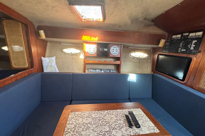 Slide: The Image of Compact bathroom in 1983 Tiara Yachts 3100 Open, featuring toilet, sink, and shower. - 27