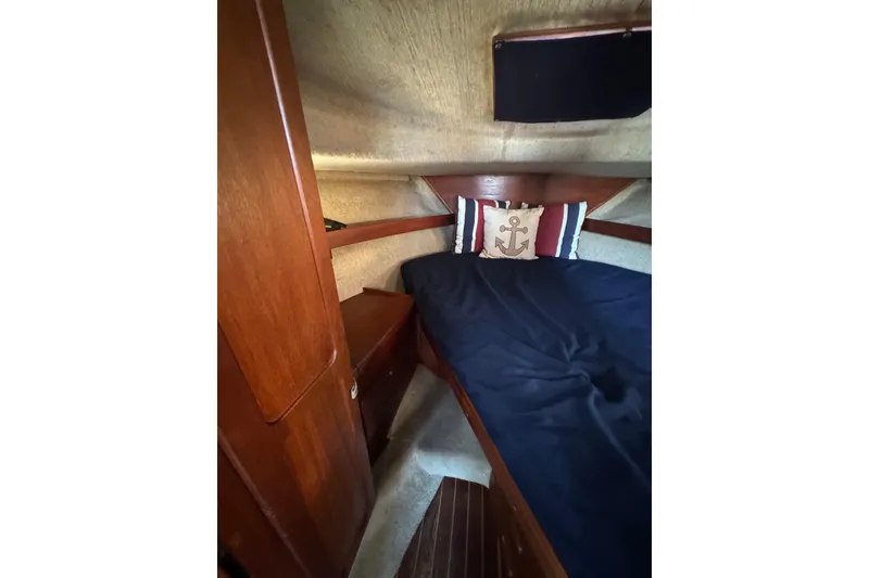 Slide: The Image of Interior of 1983 Tiara Yachts 3100 Open with cozy seating and nautical decor. - 29