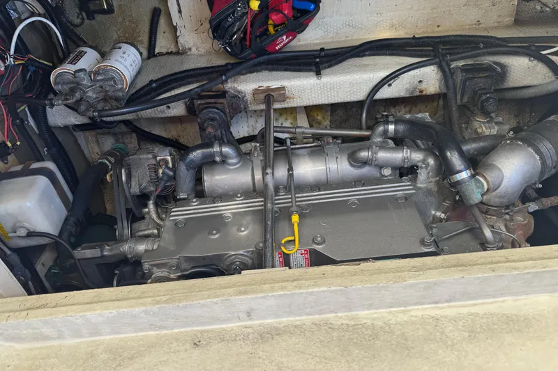 Slide: The Image of Engine of a 1983 Tiara Yachts 3100 Open, featuring a Yanmar diesel engine. - 33