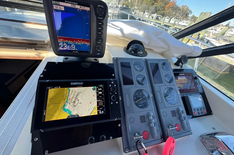 Slide: The Image of 1983 Tiara Yachts 3100 Open interior with seating and helm area. - 9