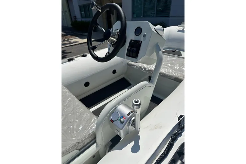 Slide: The Image of 2026 East Marine NEW 320 boat with Linergy electric motor, featuring modern steering console. - 6