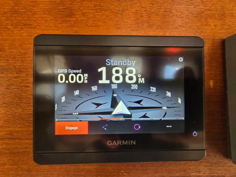 Slide: The Image of Garmin navigation display on 2001 Nordic Tug 32, showing compass heading and GPS speed. - 14