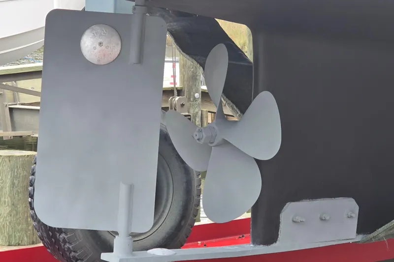 Slide: The Image of Close-up of a 2001 Nordic Tug 32 propeller and rudder with Seakeeper stabilizer. - 2