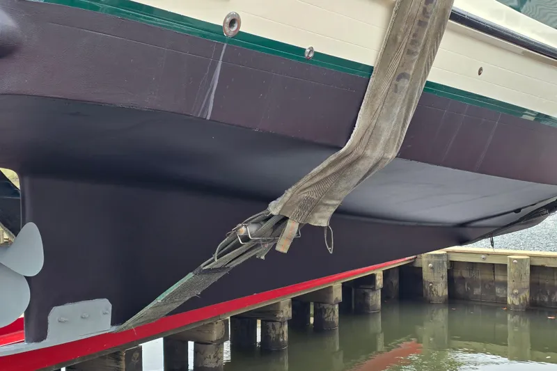 Slide: The Image of 2001 Nordic Tug 32 with Seakeeper, hull view during maintenance at dock. - 3