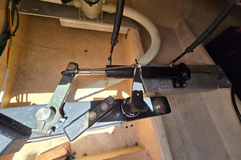 Slide: The Image of Engine compartment of a 2001 Nordic Tug 32, showing mechanical components and hydraulic lines. - 34