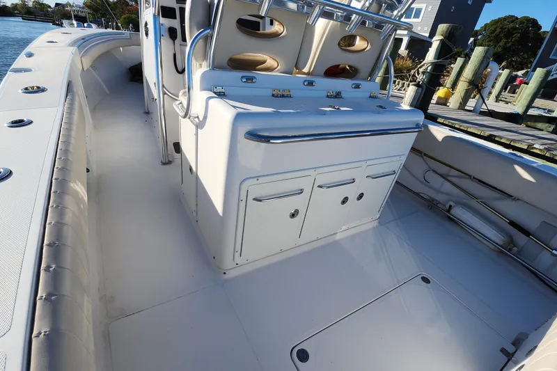 Slide: The Image of 2015 Southport 29 Tournament Edition boat interior with storage and seating. - 18