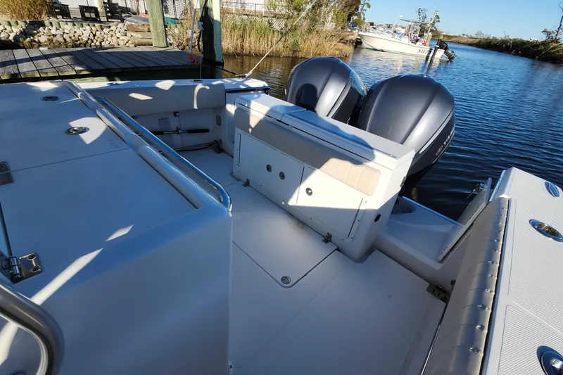 Slide: The Image of 2015 Southport 29 Tournament Edition boat with dual engines docked by the water. - 19