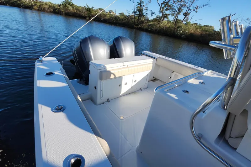 Slide: The Image of 2015 Southport 29 Tournament Edition boat with dual engines on a calm river. - 20