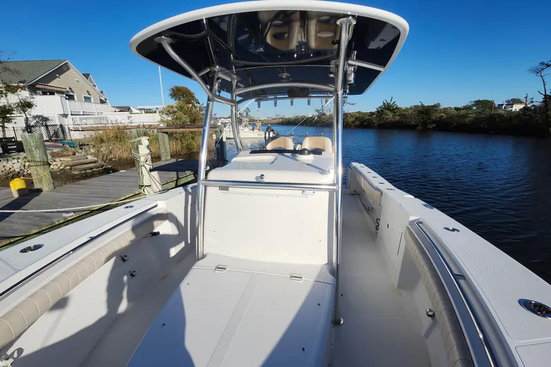 Slide: The Image of 2015 Southport 29 Tournament Edition boat docked by a serene waterfront. - 24